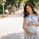 pregnant-woman-posing-park_1303-10708